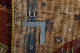 Surface texture of 2000s Persian Gabbeh rug with natural Wool and intricate pattern
