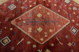 Central medallion detail of 2000s Persian Gabbeh rug from Iran / Persia
