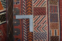 Surface texture of 2000s Persian Gabbeh rug with natural Wool and intricate pattern