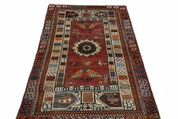 Surface texture of 2000s Persian Gabbeh rug with natural Wool and intricate pattern
