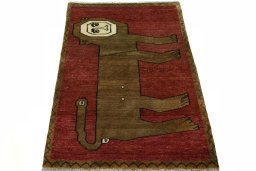 Surface texture of 2000s Persian Gabbeh rug with natural Wool and intricate pattern