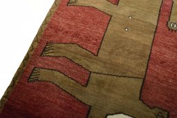 Backside of handmade 2000s Persian Gabbeh rug showing knot structure and weave density