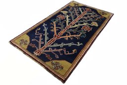 Corner detail of 2000s Persian Gabbeh rug showing border pattern and Wool pile
