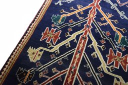 Backside of handmade 2000s Persian Gabbeh rug showing knot structure and weave density