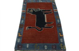 Surface texture of 2000s Persian Gabbeh rug with natural Wool and intricate pattern
