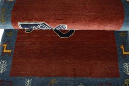 Full view of 2000s Persian Gabbeh rug from Iran / Persia, 132 × 81 cm in Red tones