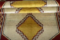 Full view of 2000s Persian Gabbeh rug from Iran / Persia, 226 × 133 cm in Beige tones