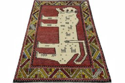 Surface texture of 2000s Persian Gabbeh rug with natural Wool and intricate pattern
