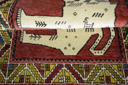 Full view of 2000s Persian Gabbeh rug from Iran / Persia, 153 × 103 cm in Red tones