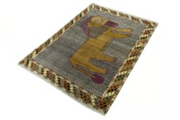 Corner detail of 2000s Persian Gabbeh rug showing border pattern and Wool pile