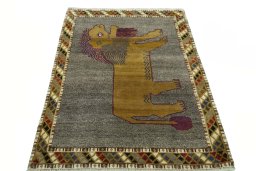Surface texture of 2000s Persian Gabbeh rug with natural Wool and intricate pattern