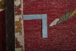 Corner detail of 2000s Persian Gabbeh rug showing border pattern and Wool pile