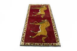 Surface texture of 2000s Persian Gabbeh rug with natural Wool and intricate pattern