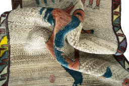 Corner detail of 2000s Persian Gabbeh rug showing border pattern and Wool pile