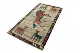 Corner detail of 2000s Persian Gabbeh rug showing border pattern and Wool pile
