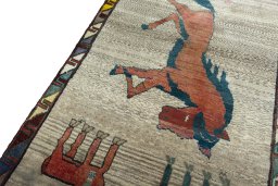 Backside of handmade 2000s Persian Gabbeh rug showing knot structure and weave density