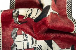 Corner detail of 2000s Persian Gabbeh rug showing border pattern and Wool pile