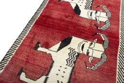 Backside of handmade 2000s Persian Gabbeh rug showing knot structure and weave density