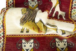 Corner detail of 2000s Persian Gabbeh rug showing border pattern and Wool pile