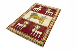 Corner detail of 2000s Persian Gabbeh rug showing border pattern and Wool pile
