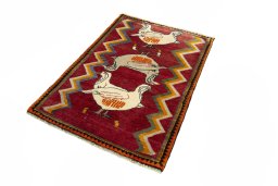 Corner detail of 2000s Persian Gabbeh rug showing border pattern and Wool pile