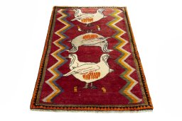 Surface texture of 2000s Persian Gabbeh rug with natural Wool and intricate pattern