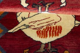 Full view of 2000s Persian Gabbeh rug from Iran / Persia, 142 × 100 cm in Red tones