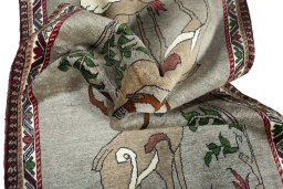 Corner detail of 2000s Persian Gabbeh rug showing border pattern and Wool pile