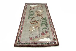 Surface texture of 2000s Persian Gabbeh rug with natural Wool and intricate pattern