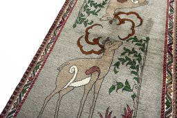 Backside of handmade 2000s Persian Gabbeh rug showing knot structure and weave density