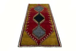 Surface texture of 2000s Persian Gabbeh rug with natural Wool and intricate pattern