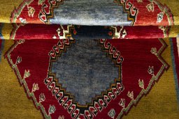 Full view of 2000s Persian Gabbeh rug from Iran / Persia, 205 × 97 cm in Red tones