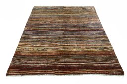 Surface texture of 2000s Persian Gabbeh rug with natural Wool and intricate pattern
