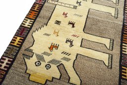 Backside of handmade 2000s Persian Gabbeh rug showing knot structure and weave density