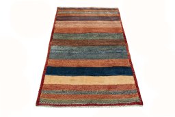Surface texture of 2000s Persian Gabbeh rug with natural Wool and intricate pattern
