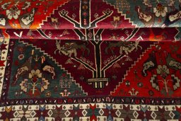 Corner detail of 2000s Persian Gabbeh rug showing border pattern and Wool pile