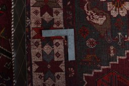 Surface texture of 2000s Persian Gabbeh rug with natural Wool and intricate pattern