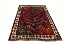 Surface texture of 2000s Persian Gabbeh rug with natural Wool and intricate pattern