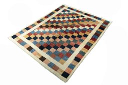 Corner detail of 2000s Persian Gabbeh rug showing border pattern and Wool pile