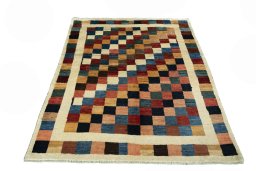Surface texture of 2000s Persian Gabbeh rug with natural Wool and intricate pattern