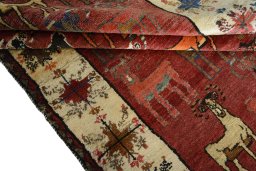 Full view of 2000s Persian Gabbeh rug from Iran / Persia, 243 × 150 cm in Red tones