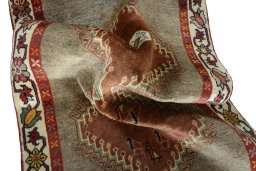 Corner detail of 2000s Persian Gabbeh rug showing border pattern and Wool pile