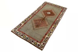 Corner detail of 2000s Persian Gabbeh rug showing border pattern and Wool pile