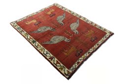 Corner detail of 2000s Persian Gabbeh rug showing border pattern and Wool pile