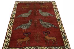 Surface texture of 2000s Persian Gabbeh rug with natural Wool and intricate pattern