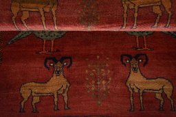 Full view of 2000s Persian Gabbeh rug from Iran / Persia, 150 × 120 cm in Red tones