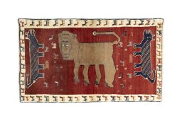 Full view of 2000s Persian Gabbeh rug from Iran / Persia, 171 × 101 cm in Red tones