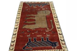 Surface texture of 2000s Persian Gabbeh rug with natural Wool and intricate pattern