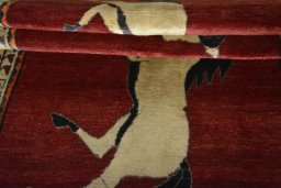 Full view of 2000s Persian Gabbeh rug from Iran / Persia, 210 × 133 cm in Red tones