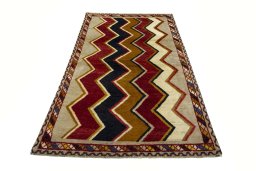 Surface texture of 2000s Persian Gabbeh rug with natural Wool and intricate pattern